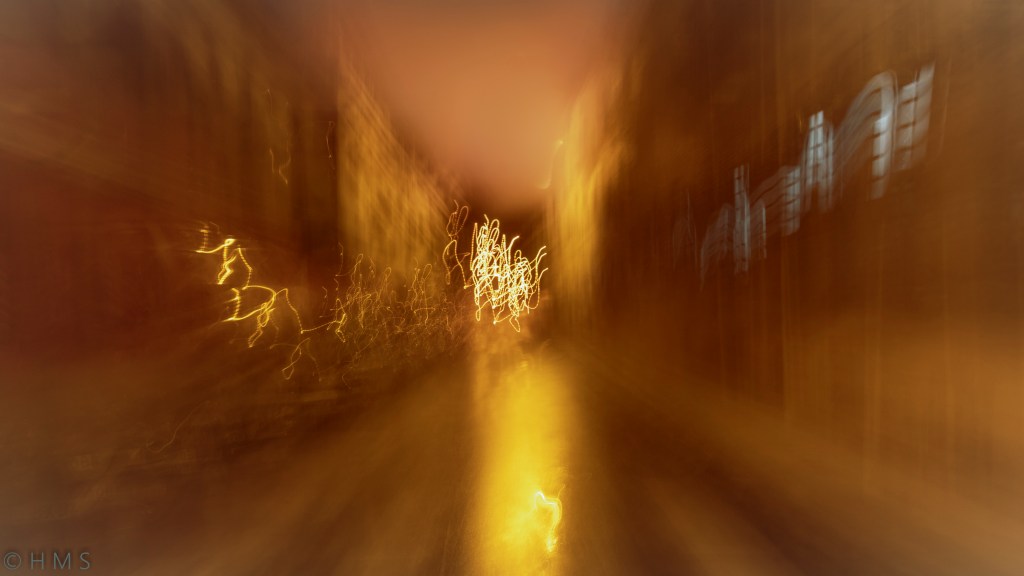 Abstract fine art photograph of a golden city with decadent tones, blurred into painterly textures through intentional camera movement. Allegorical Abstractionism by Héctor Morón