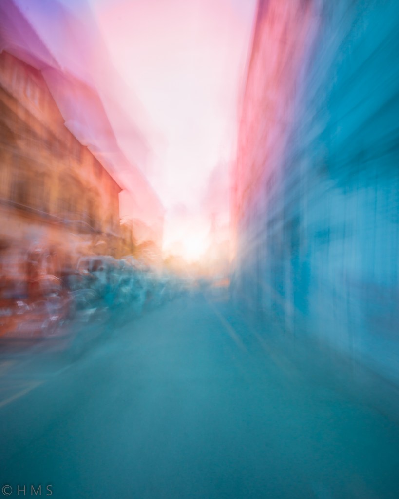 Abstract urban photograph with blurred cars in motion, exploring the isolation of vehicles in the city, by Héctor Morón