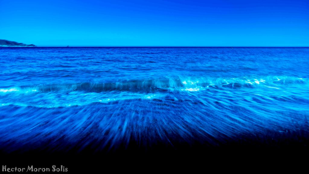 ICM fine art abstract seascape photograph of a hypnotic sea with black background, symbolic ocean of no return – by Héctor Morón