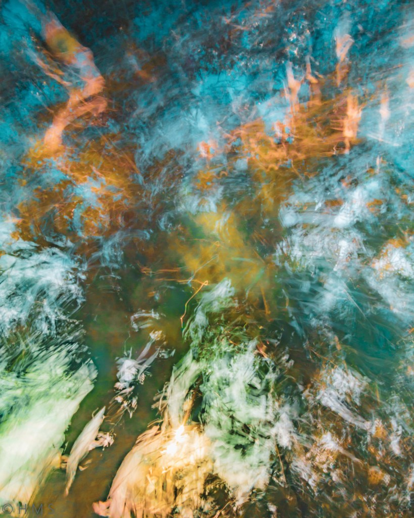 ICM abstract fine art photograph with turquoise sky tones and earthy soil colors blending through motion, by Héctor Morón.