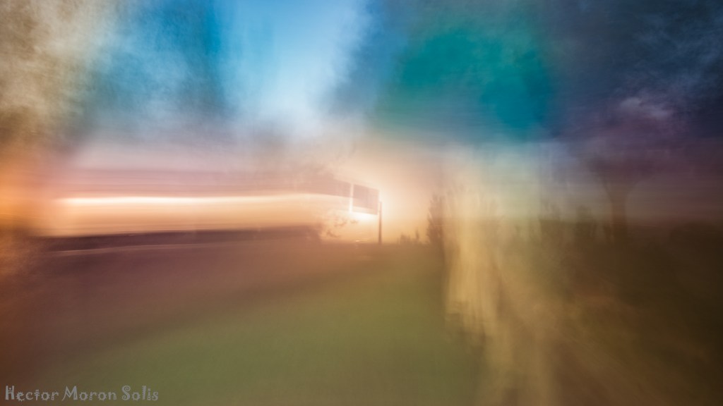 ICM fine art abstract photograph of a luminous pole on a highway at dusk, symbolizing the transition from natural to artificial light — Allegorical Abstractionism by Héctor Morón.